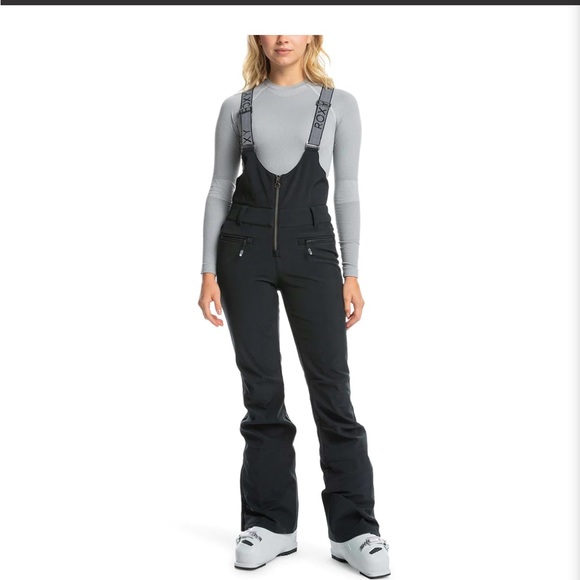 Roxy Women's Summit Bib Pants in pink. - Picture 1 of 9